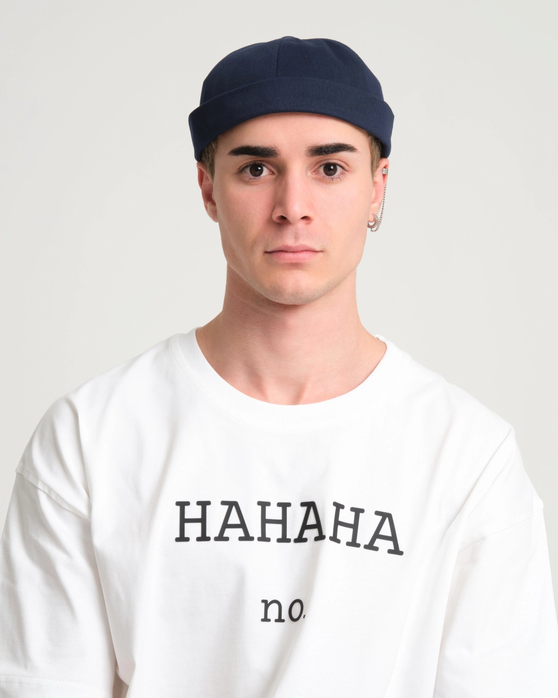 man wearing navy docker cap