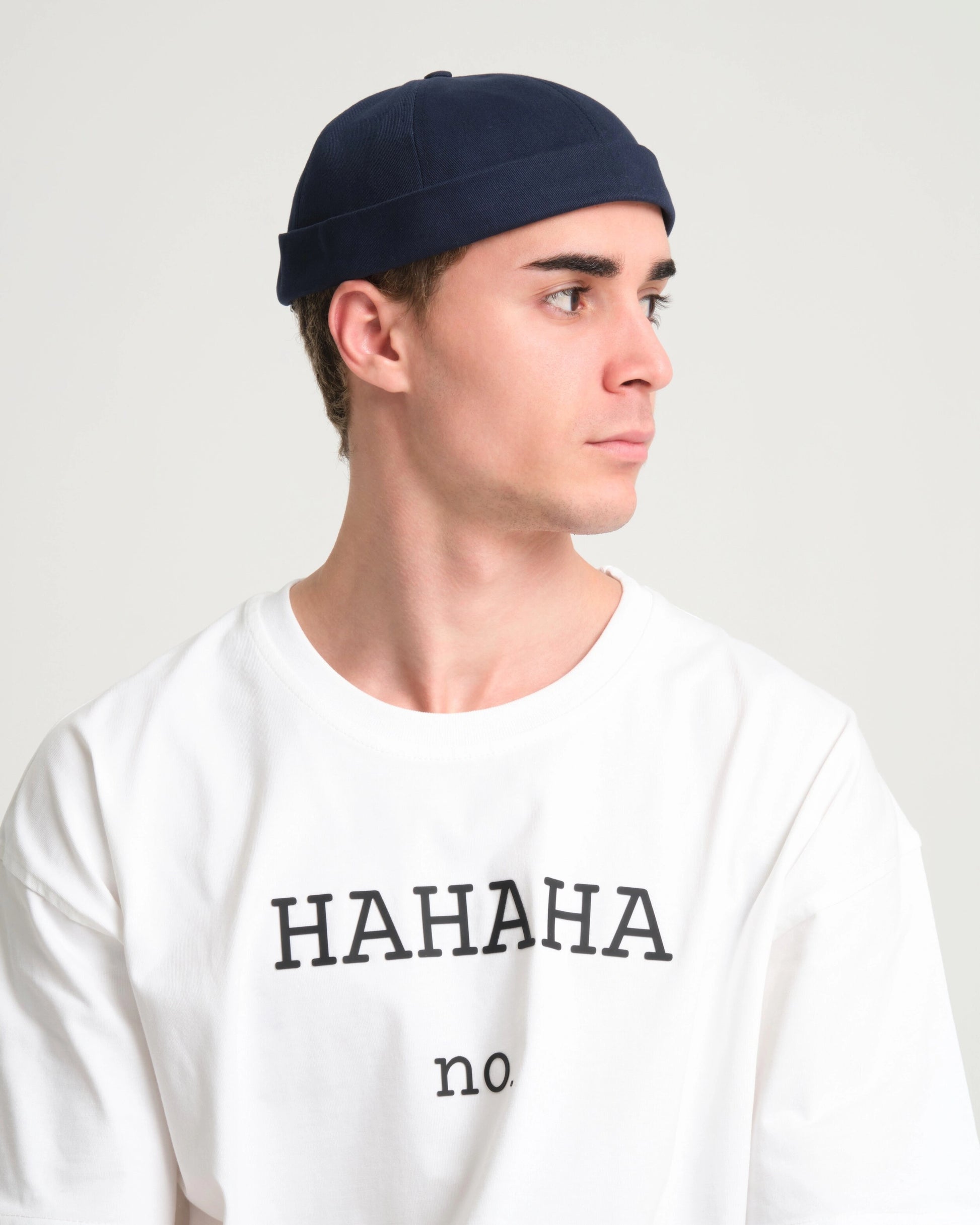 man wearing navy blue docker hat