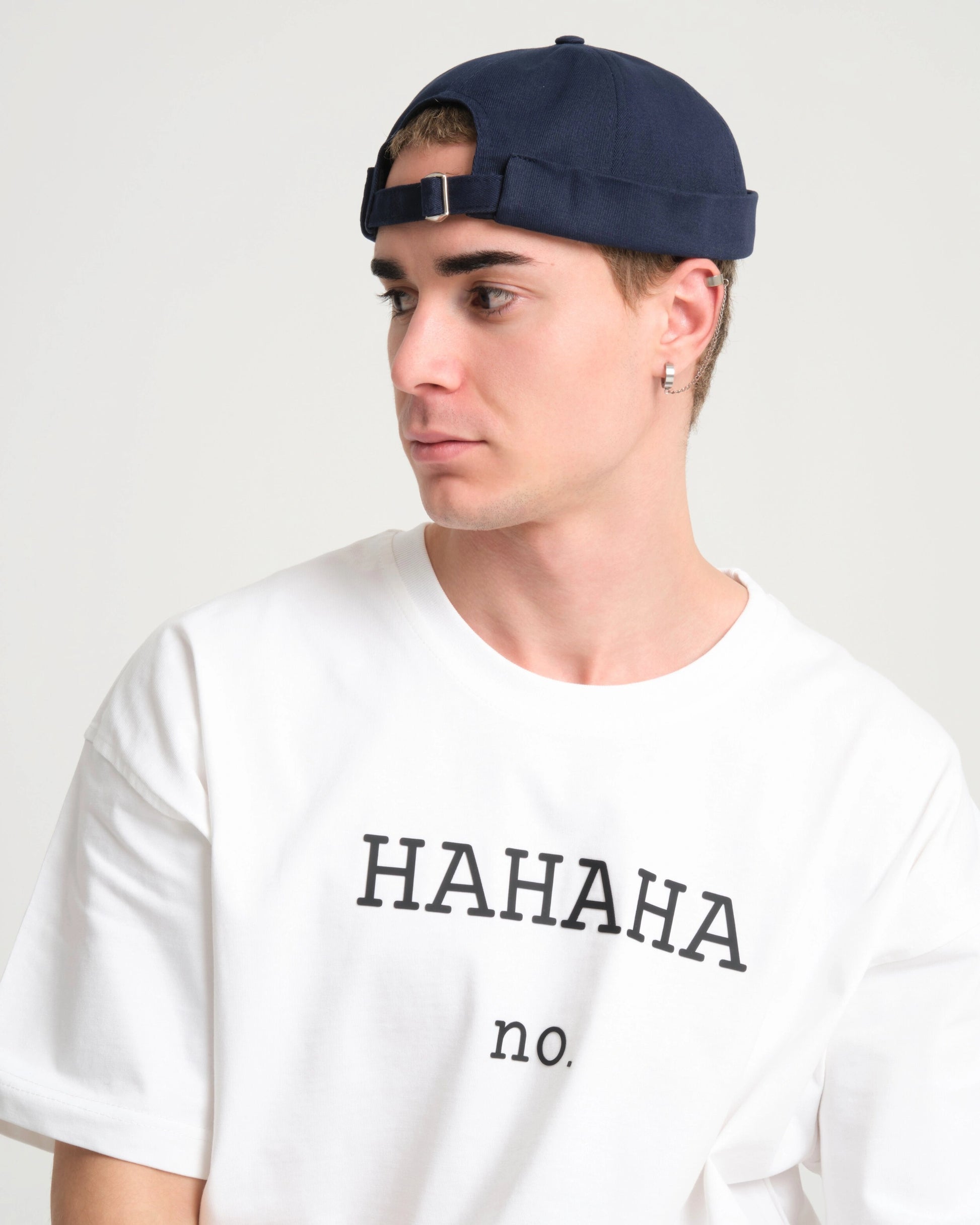 man wearing navy docker hat