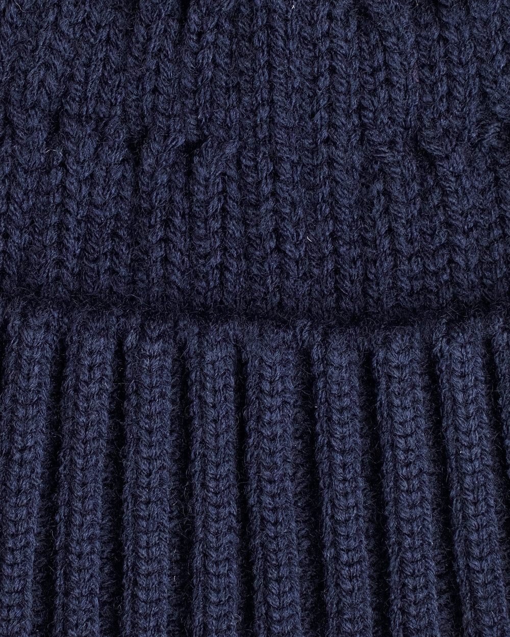 close look of navy fisherman beanie 