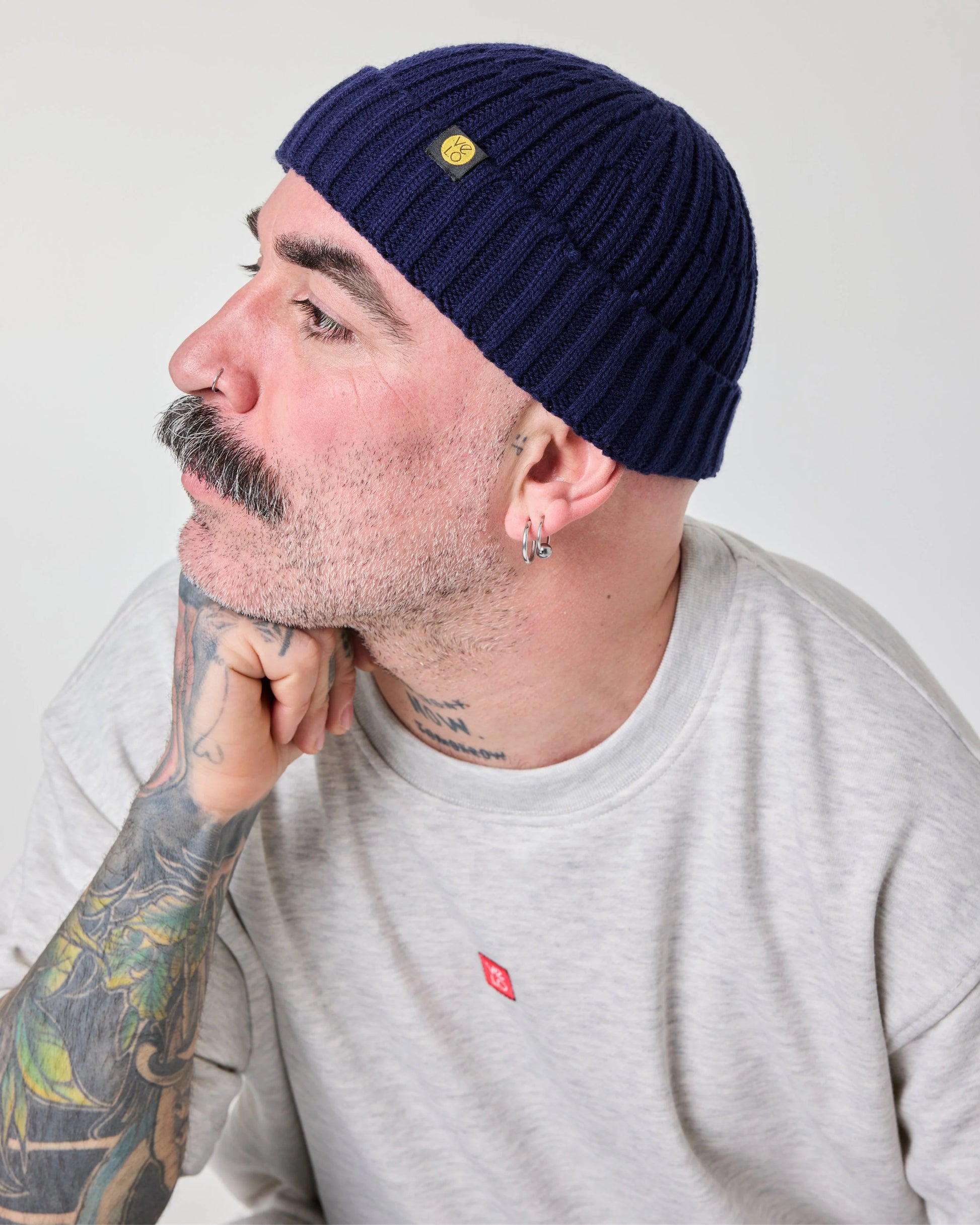 side view of a man wearing Navy Fisherman Beanie