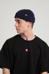 side view of a man wearing Navy Fisherman Beanie