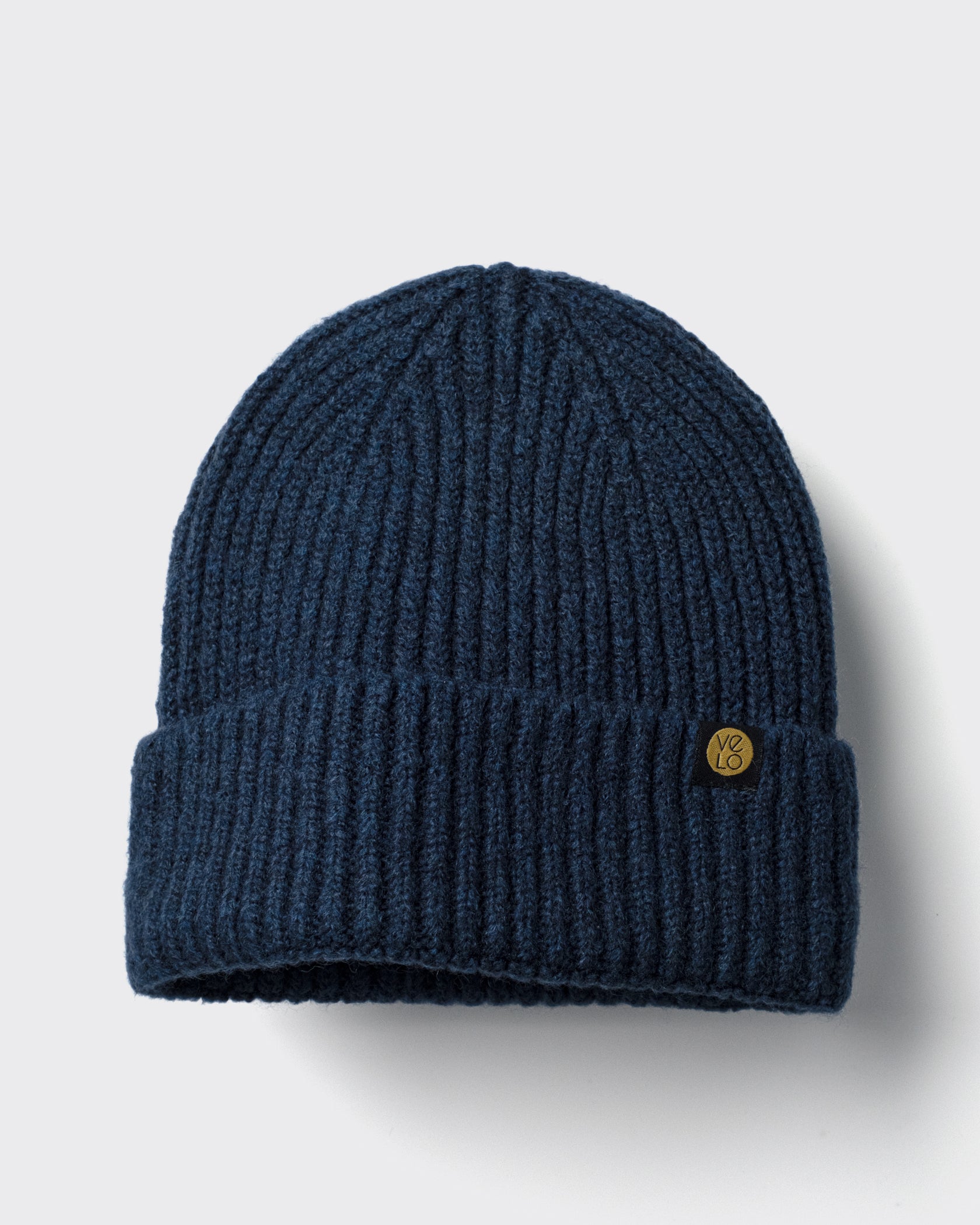 Navy Lux Beanie on a light gray background