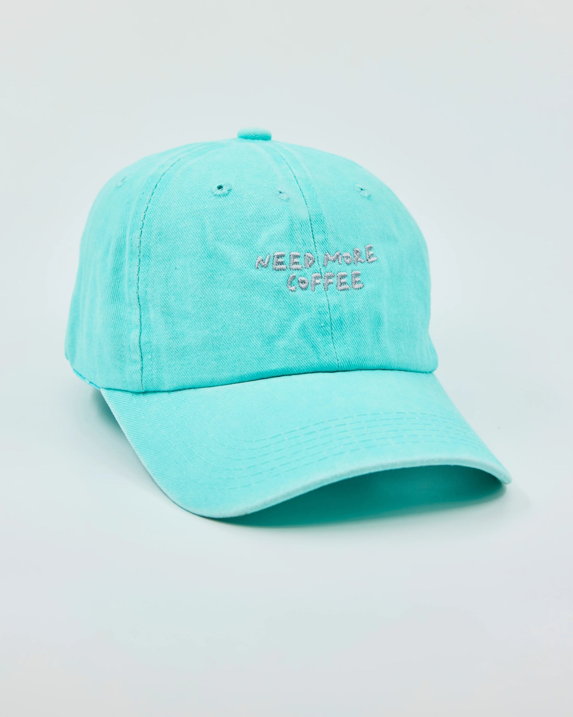 Side view of Need More Coffee Aqua Blue Washed Cap