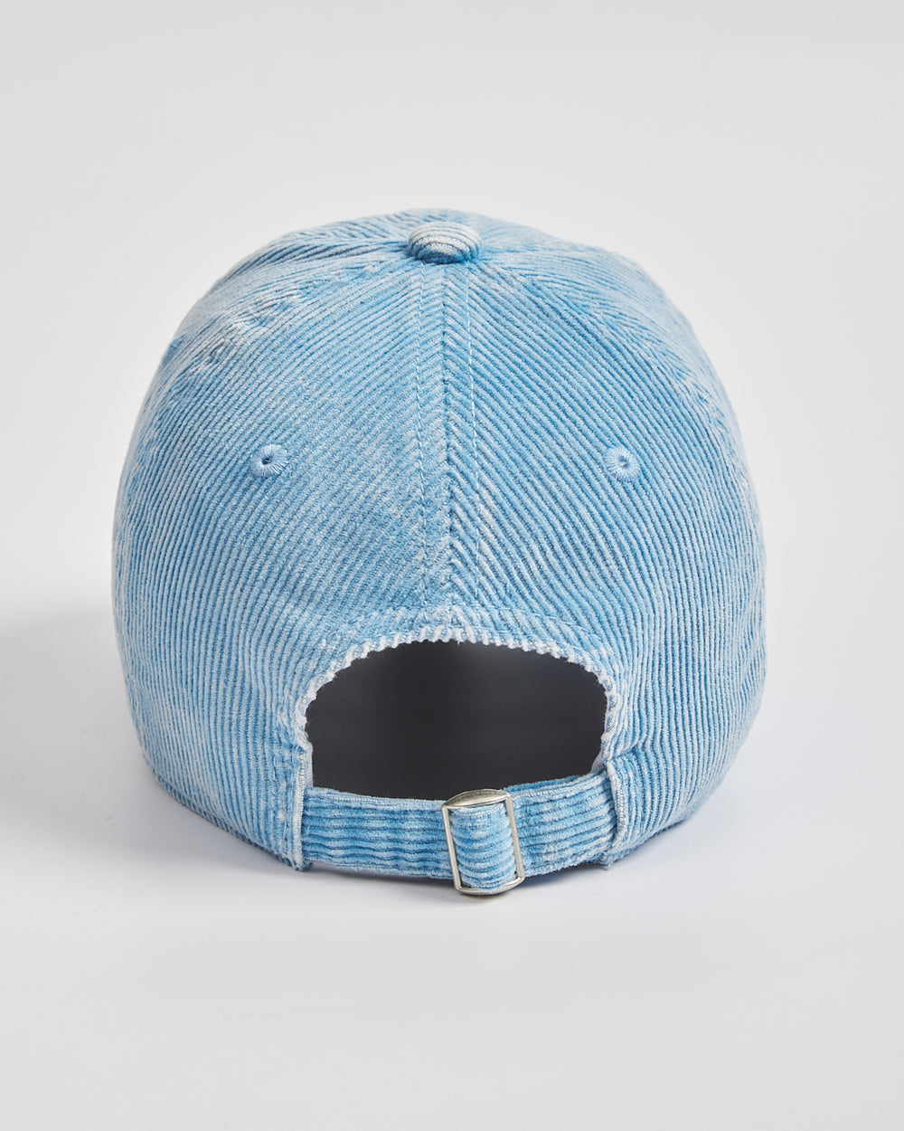 Blue cap on a light gray background