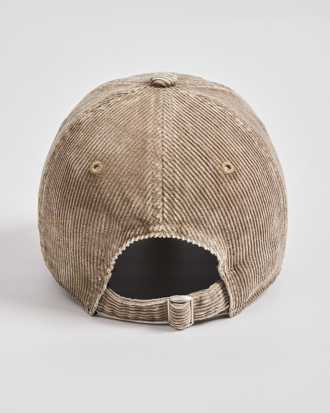 Beige corduroy cap on a white background