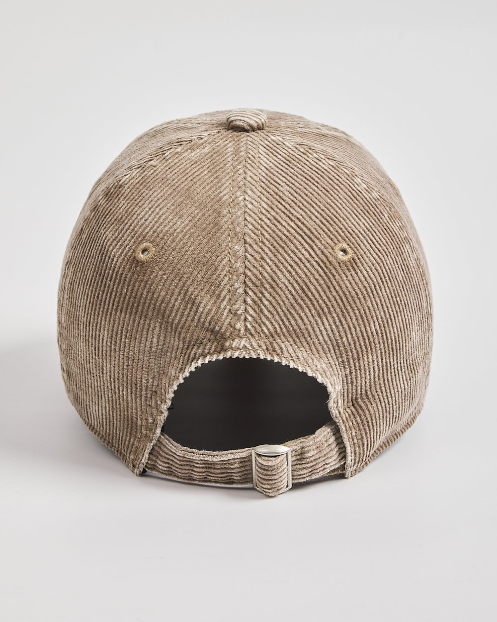 Beige corduroy cap on a white background