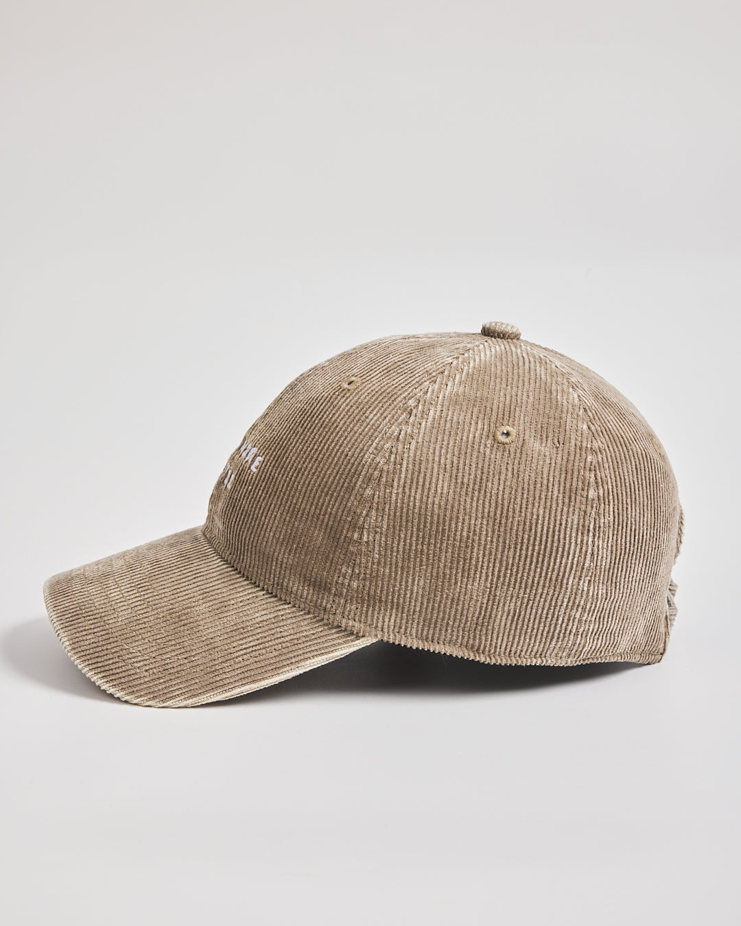 Beige corduroy cap on a light gray background