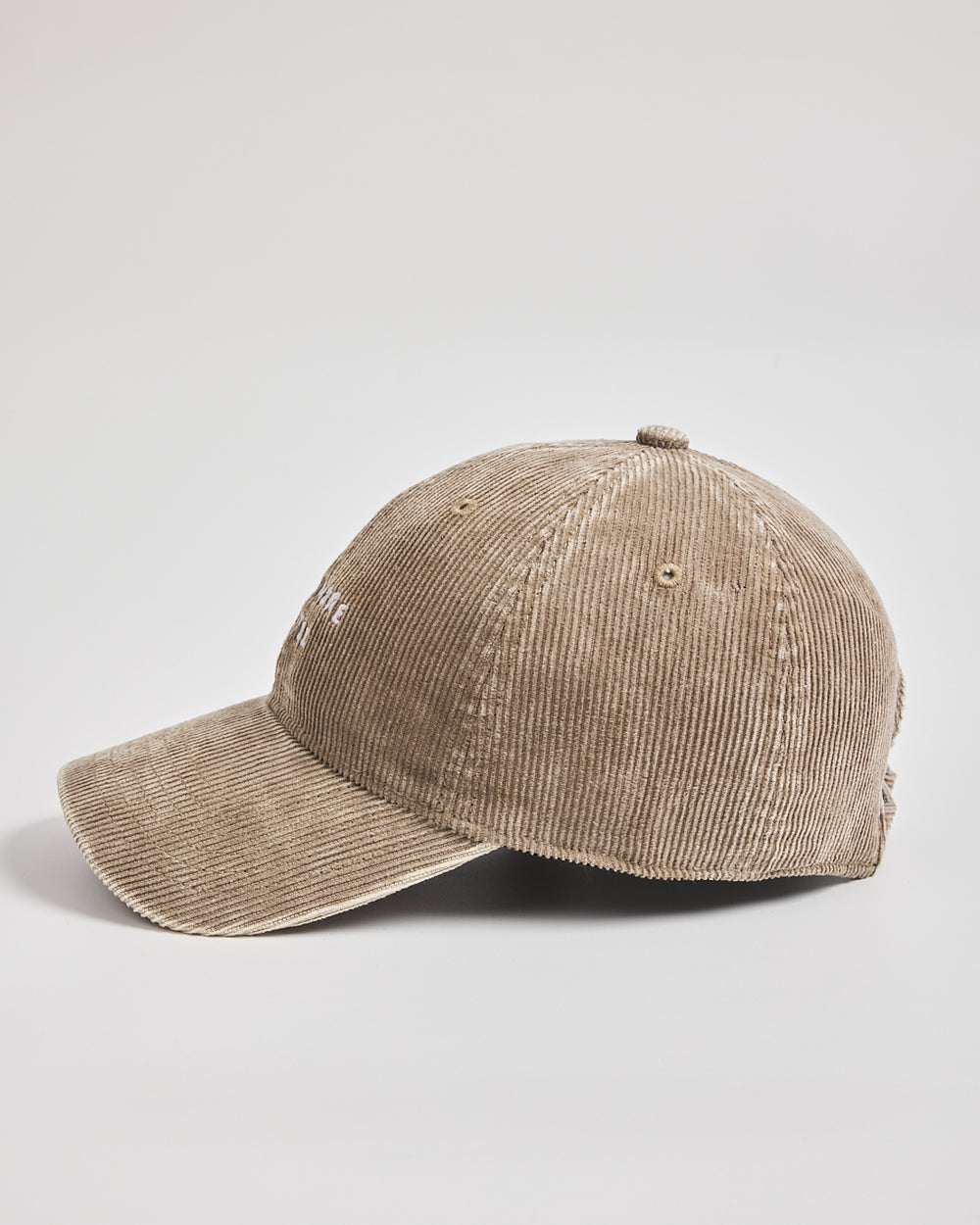 Beige corduroy cap on a light gray background