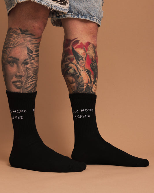Side view of Need More Coffee Black Socks