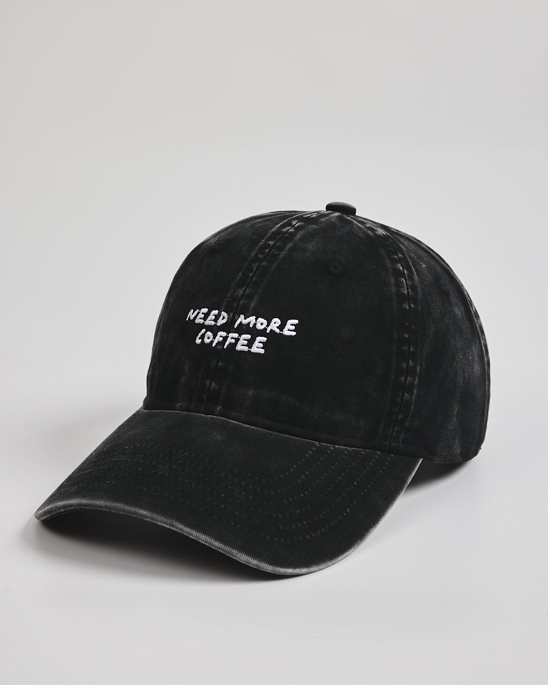 Side view of Need More Coffee Black Washed Cap