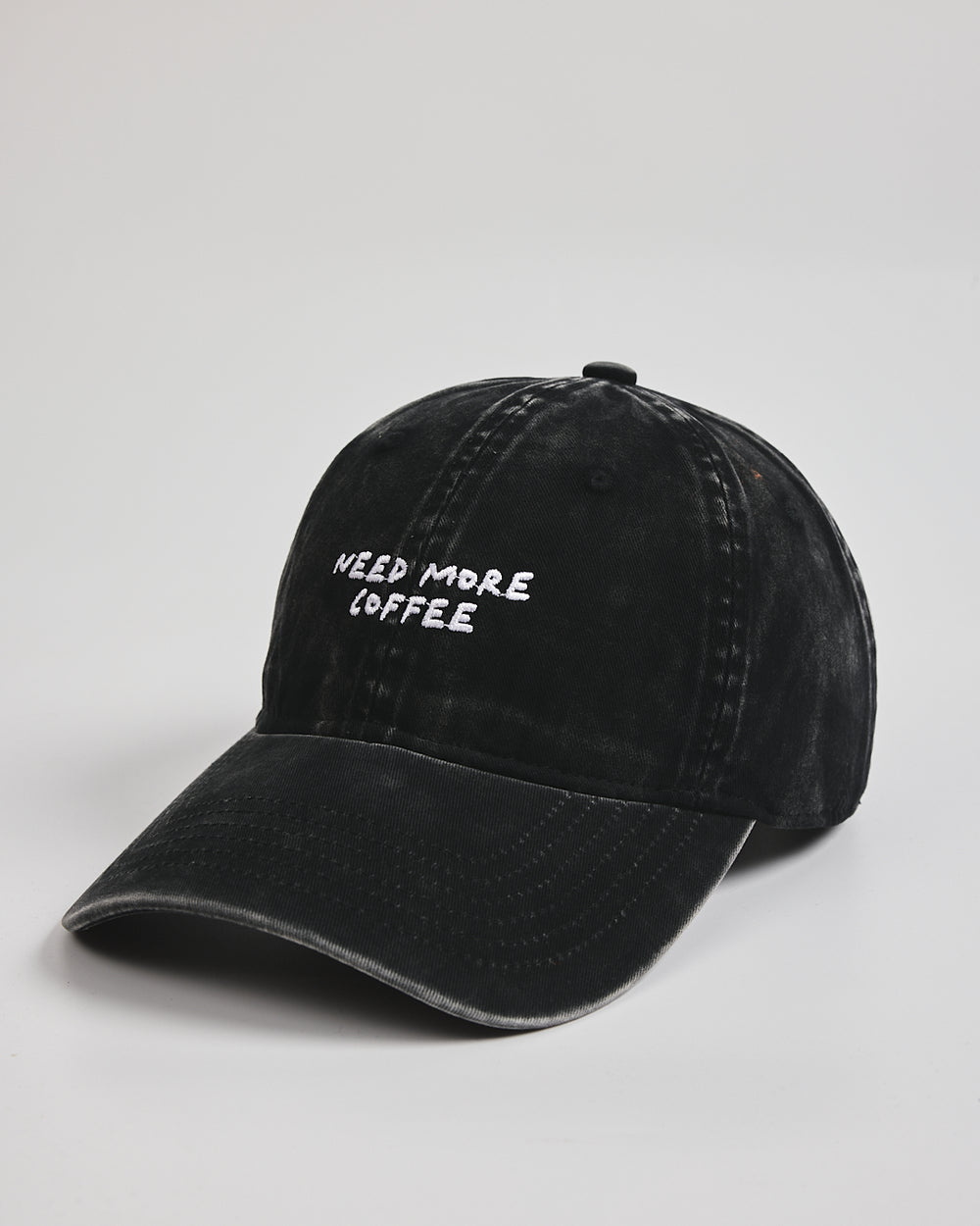 Side view of Need More Coffee Black Washed Cap