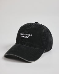 Side view of Need More Coffee Black Washed Cap