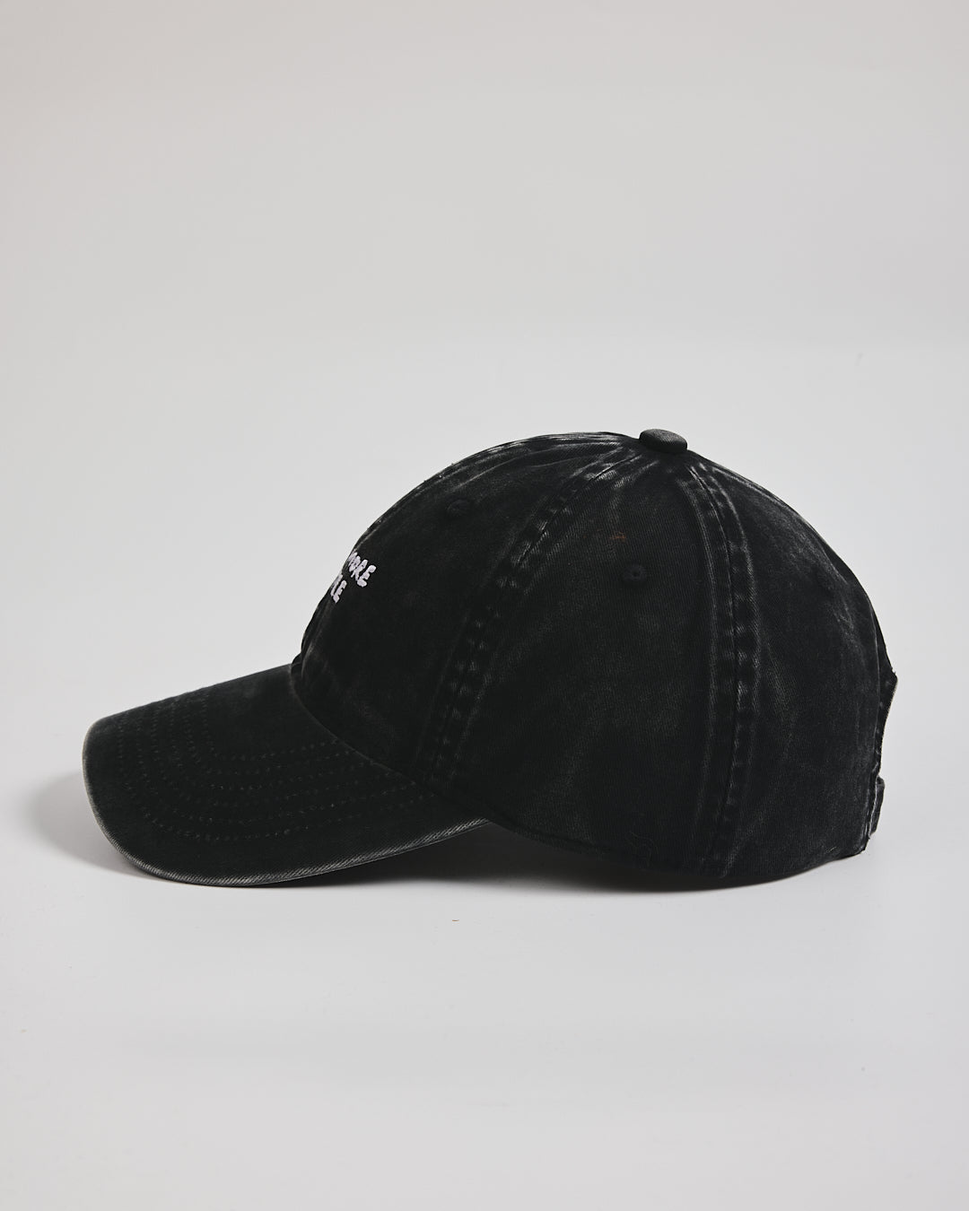 Need More Coffee Black Washed Cap on a light gray background