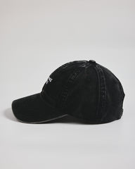 Need More Coffee Black Washed Cap on a light gray background