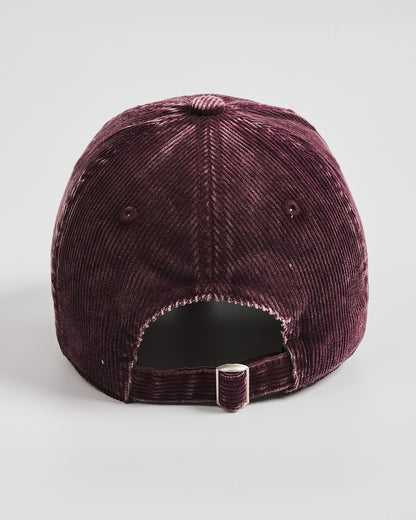 Purple velvet cap on a light gray background