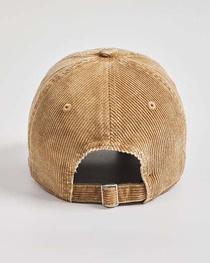 Camel corduroy cap on a light gray background