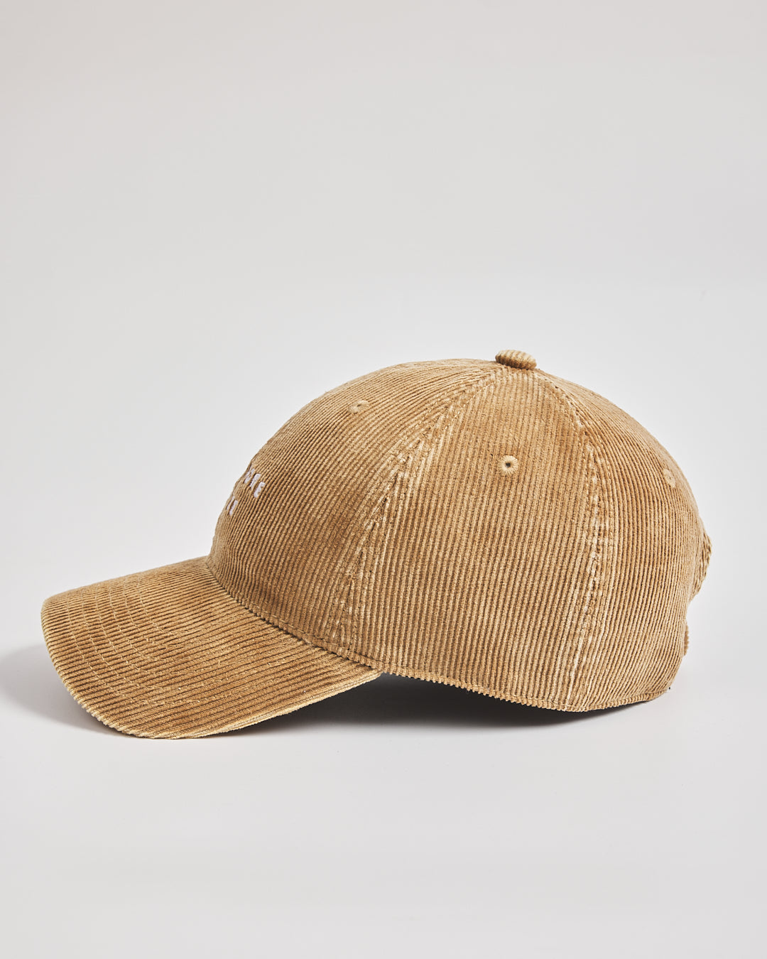 Camel corduroy cap on a light gray background