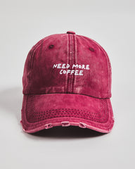 Front view of Need More Coffee Cherry Washed Cap