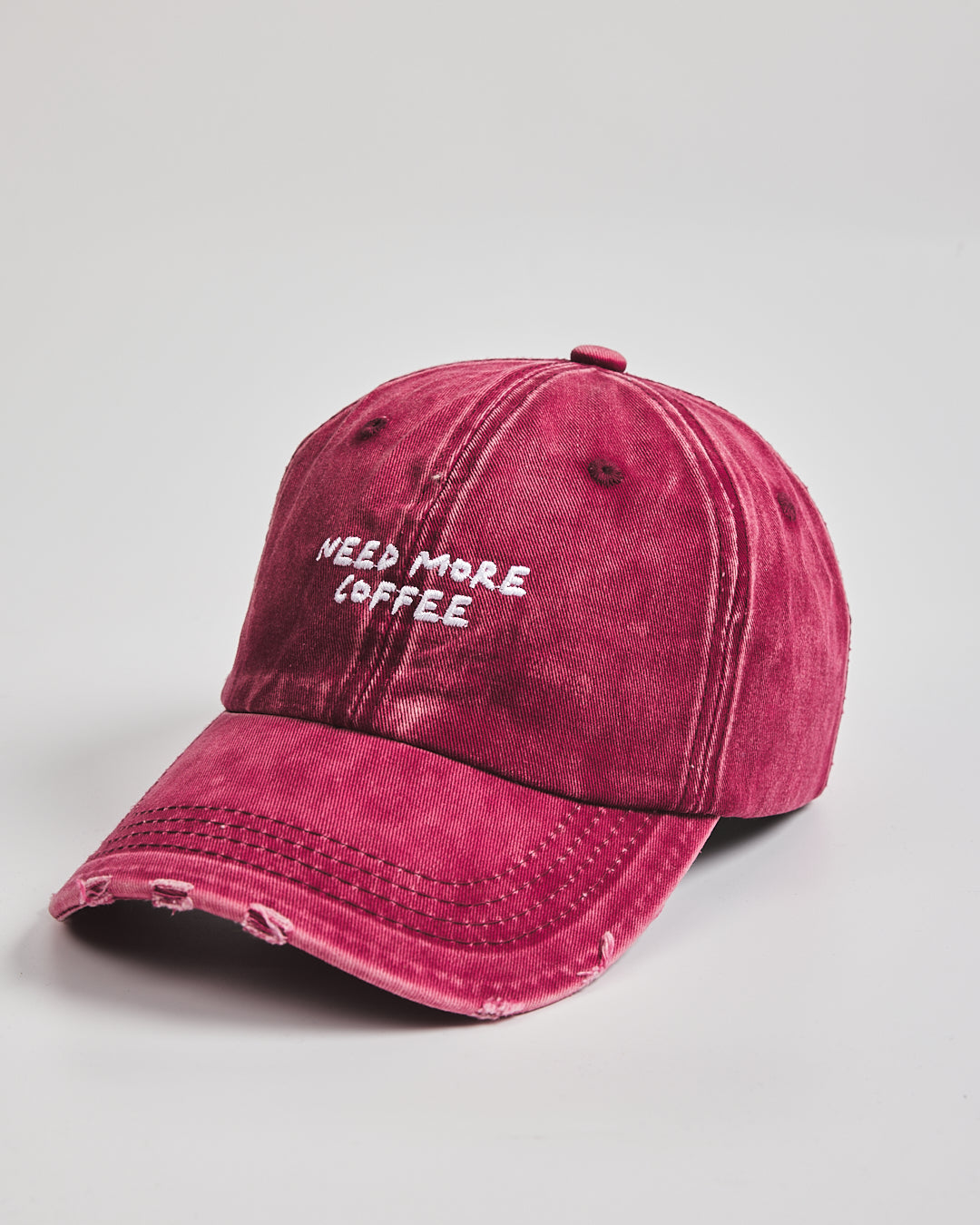 Side view of Need More Coffee Cherry Washed Cap