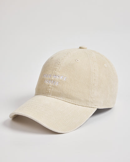 Cream cap with text on a light gray background