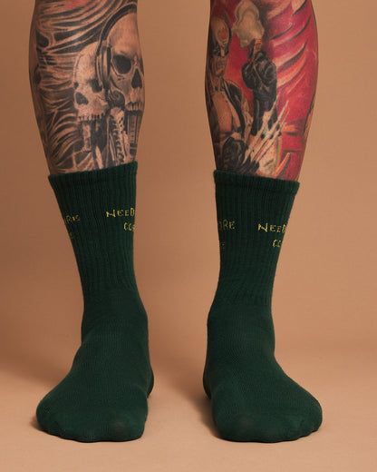 Front view of Need More Coffee Dark Green Socks