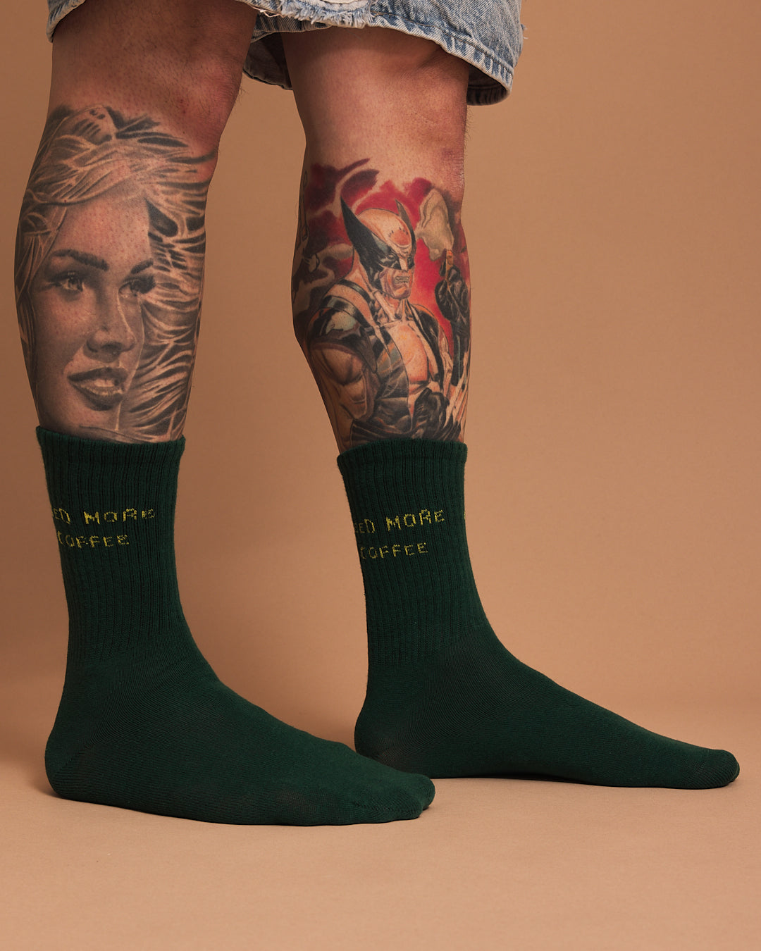 Side view of Need More Coffee Dark Green Socks