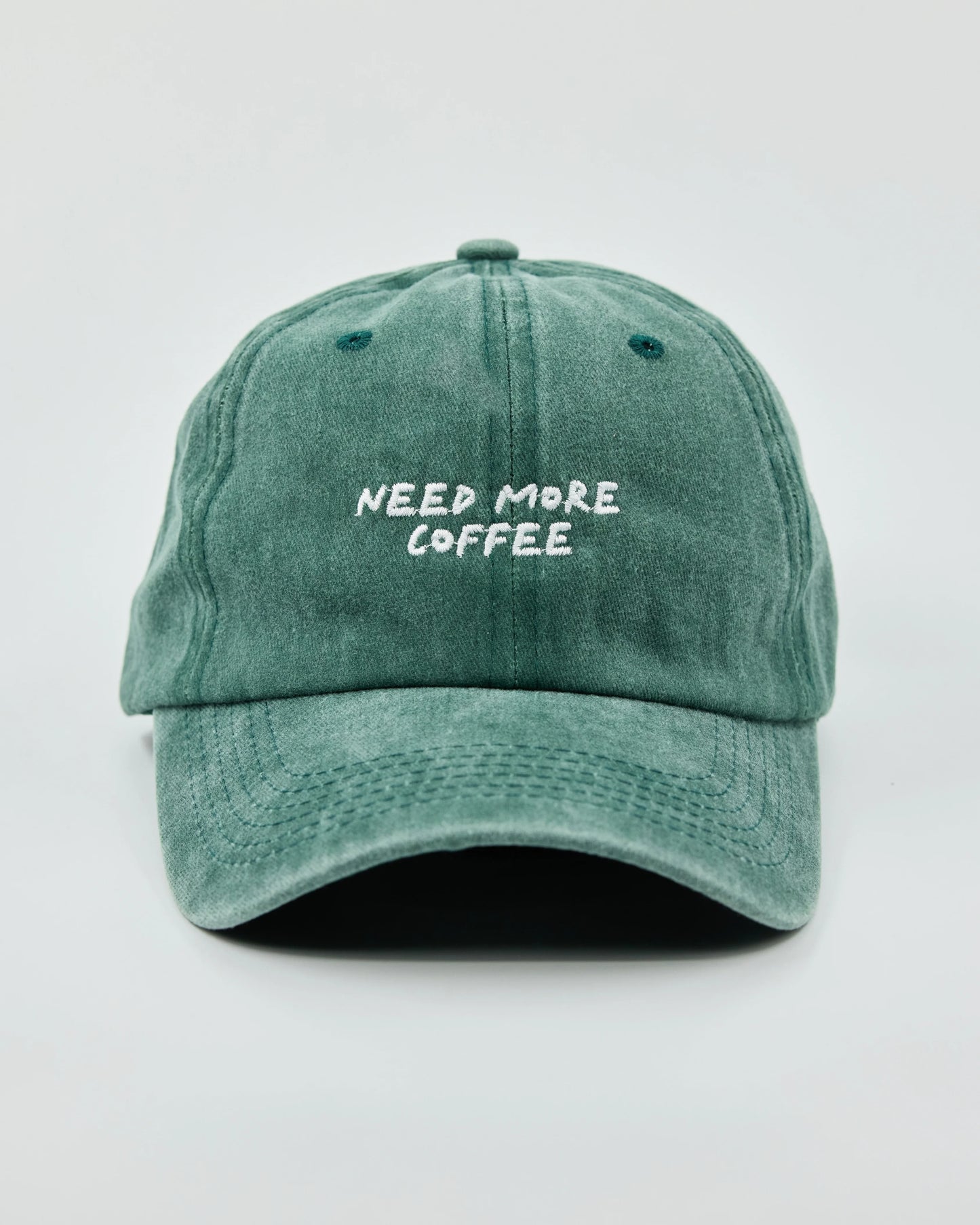 Front view of Need More Coffee Dark Green Washed Cap