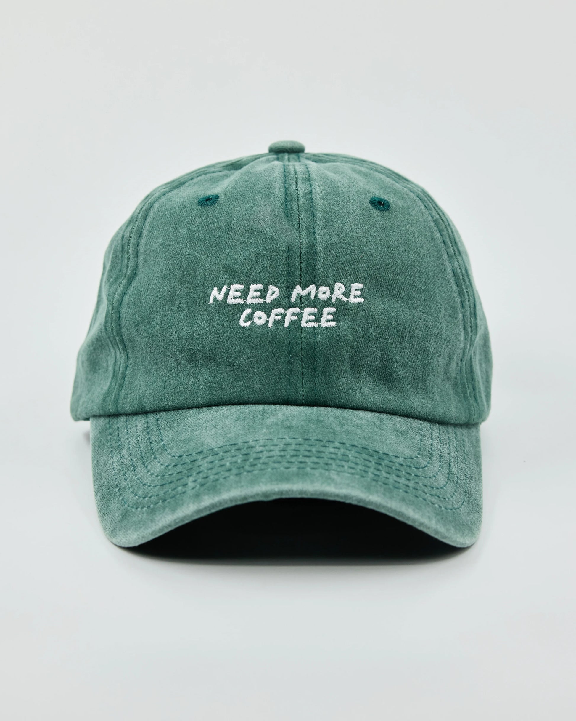 Front view of Need More Coffee Dark Green Washed Cap