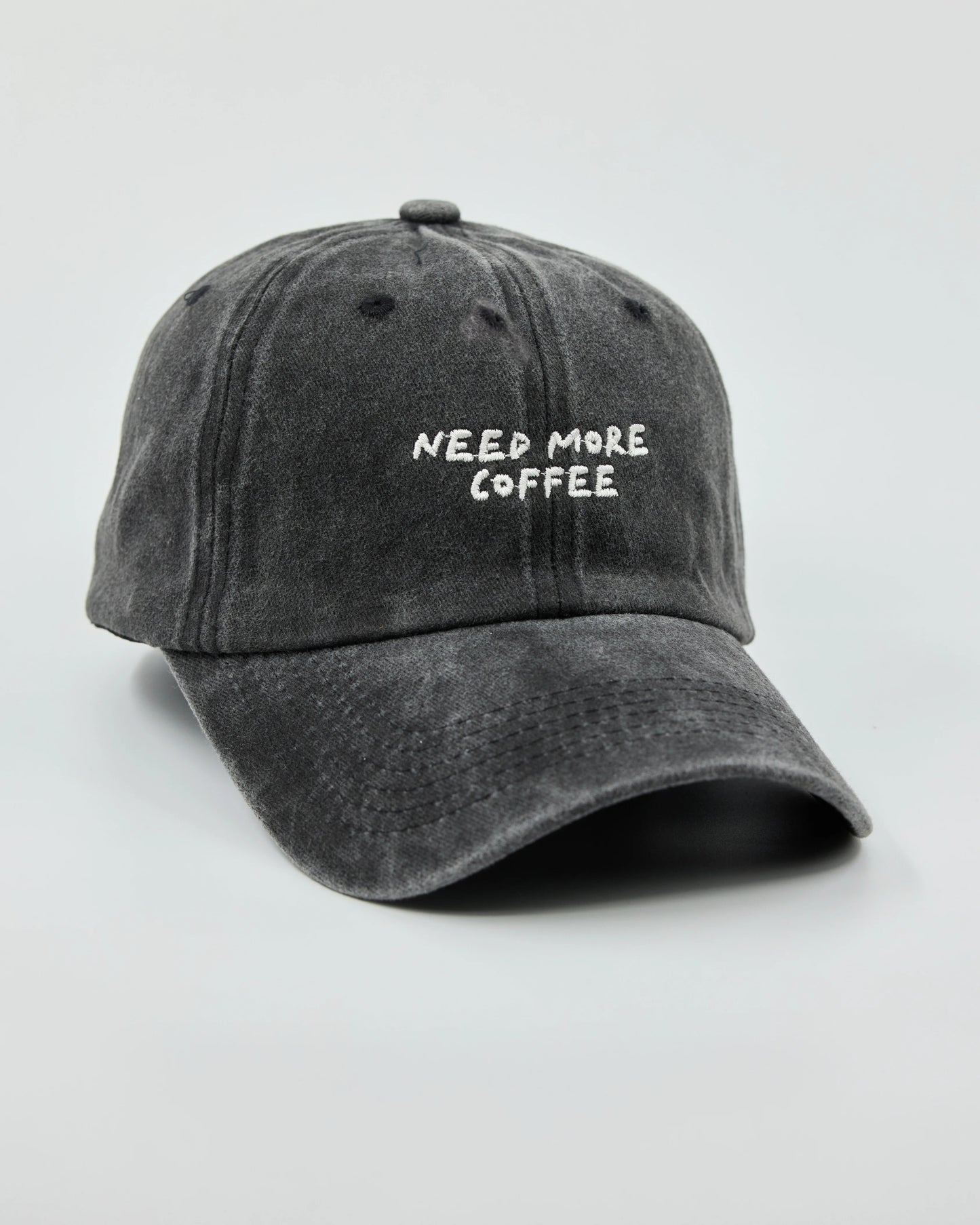 Side view of Need More Coffee Dark Grey Washed Cap