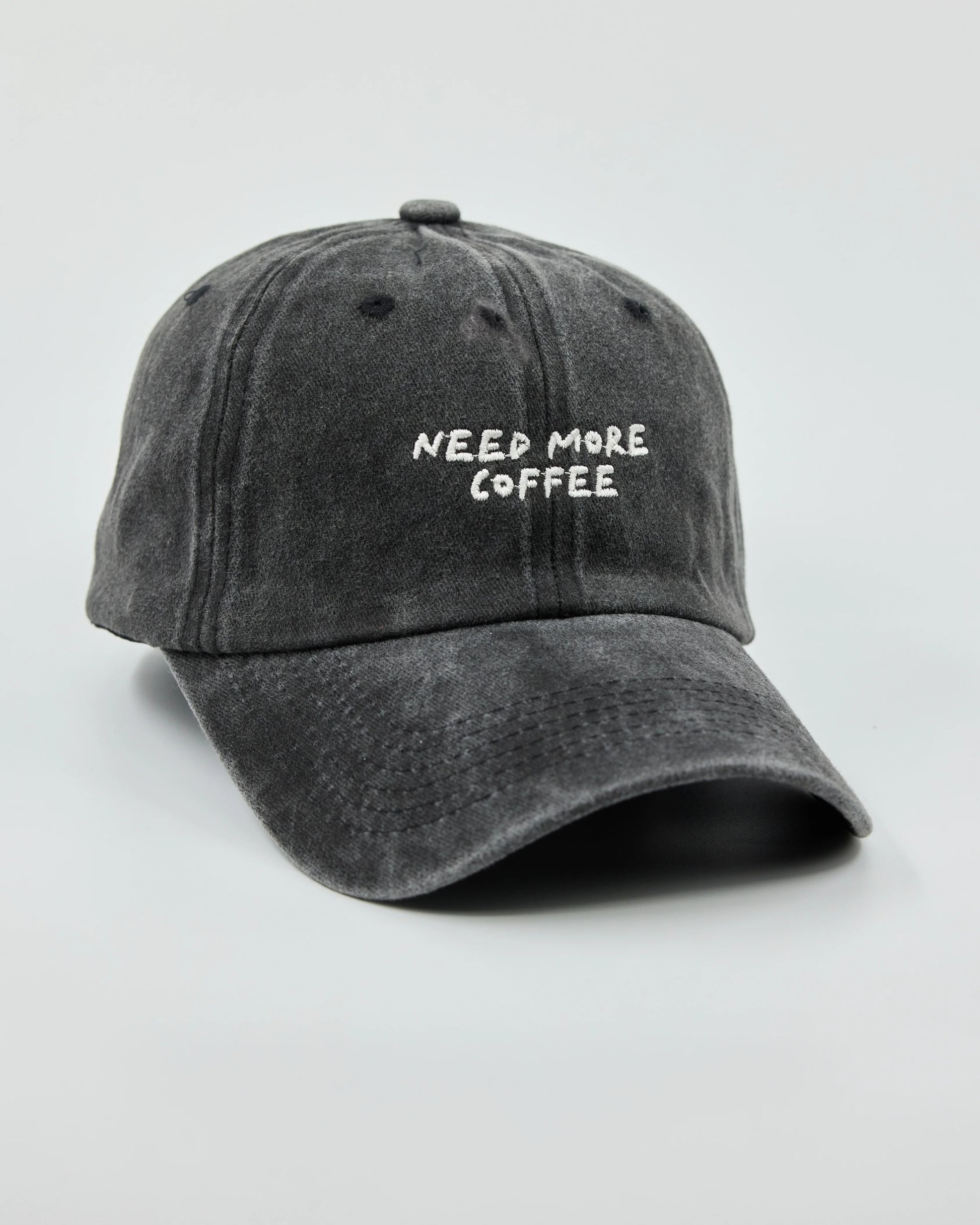 Side view of Need More Coffee Dark Grey Washed Cap