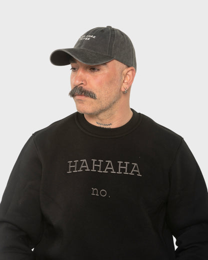 A man wearing the Need More Coffee Dark Grey Washed Cap