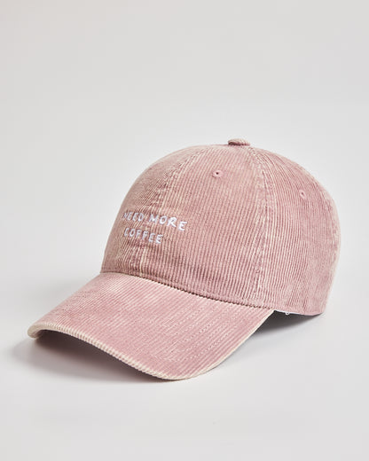 Pink corduroy cap with text on a light gray background