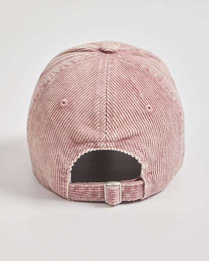 Pink corduroy cap on a light gray background