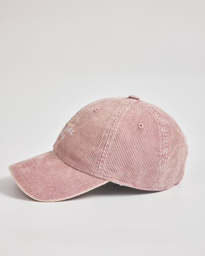 Pink corduroy cap on a light gray background