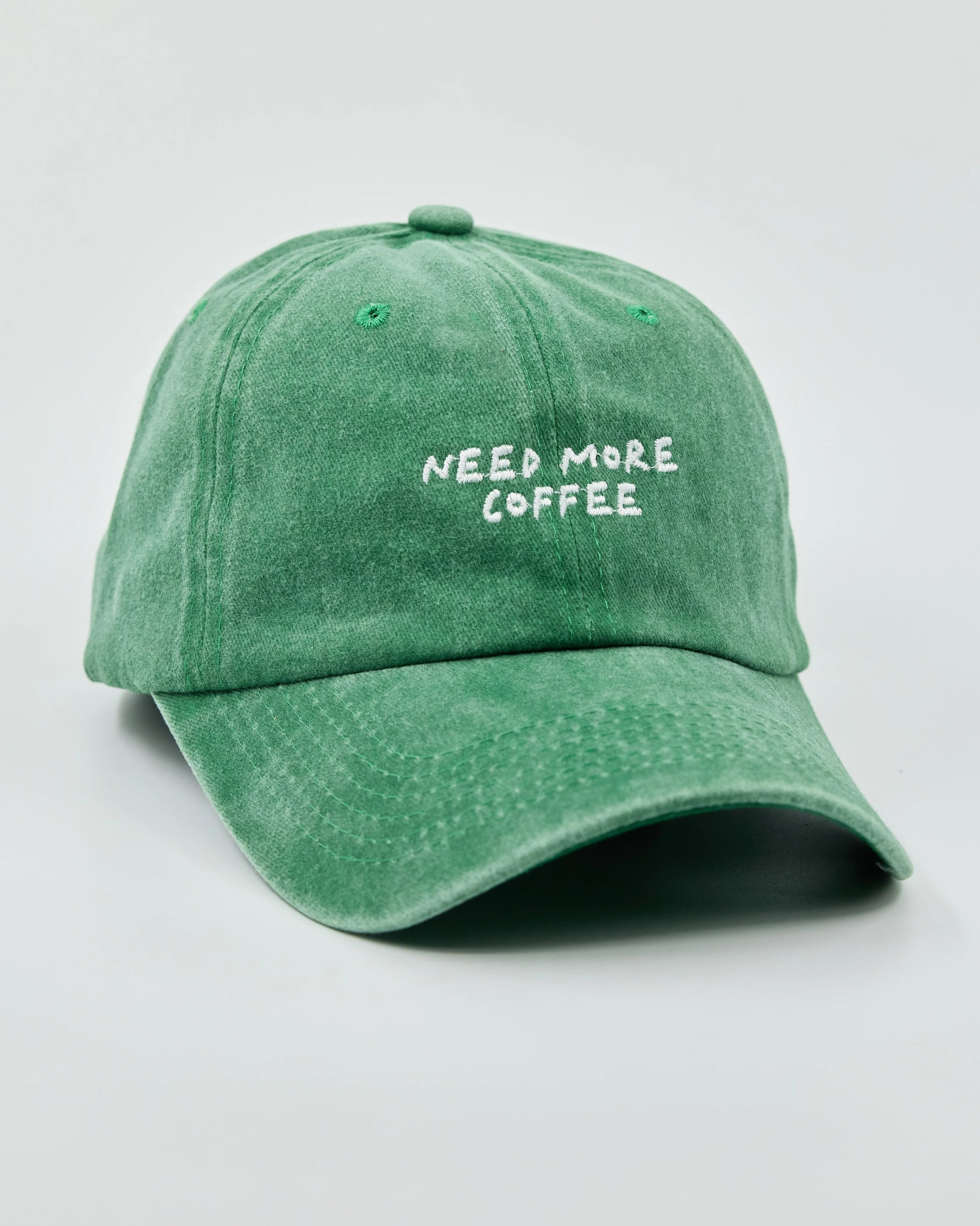 Side view of Need More Coffee Green Washed Cap