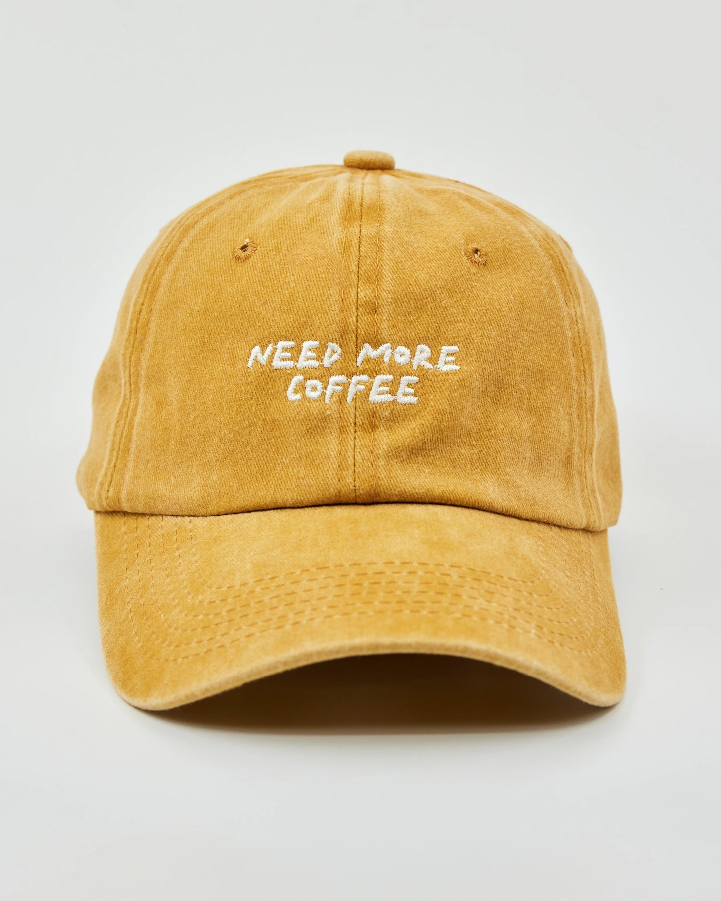 Front view of Need More Coffee Mustard Washed Cap