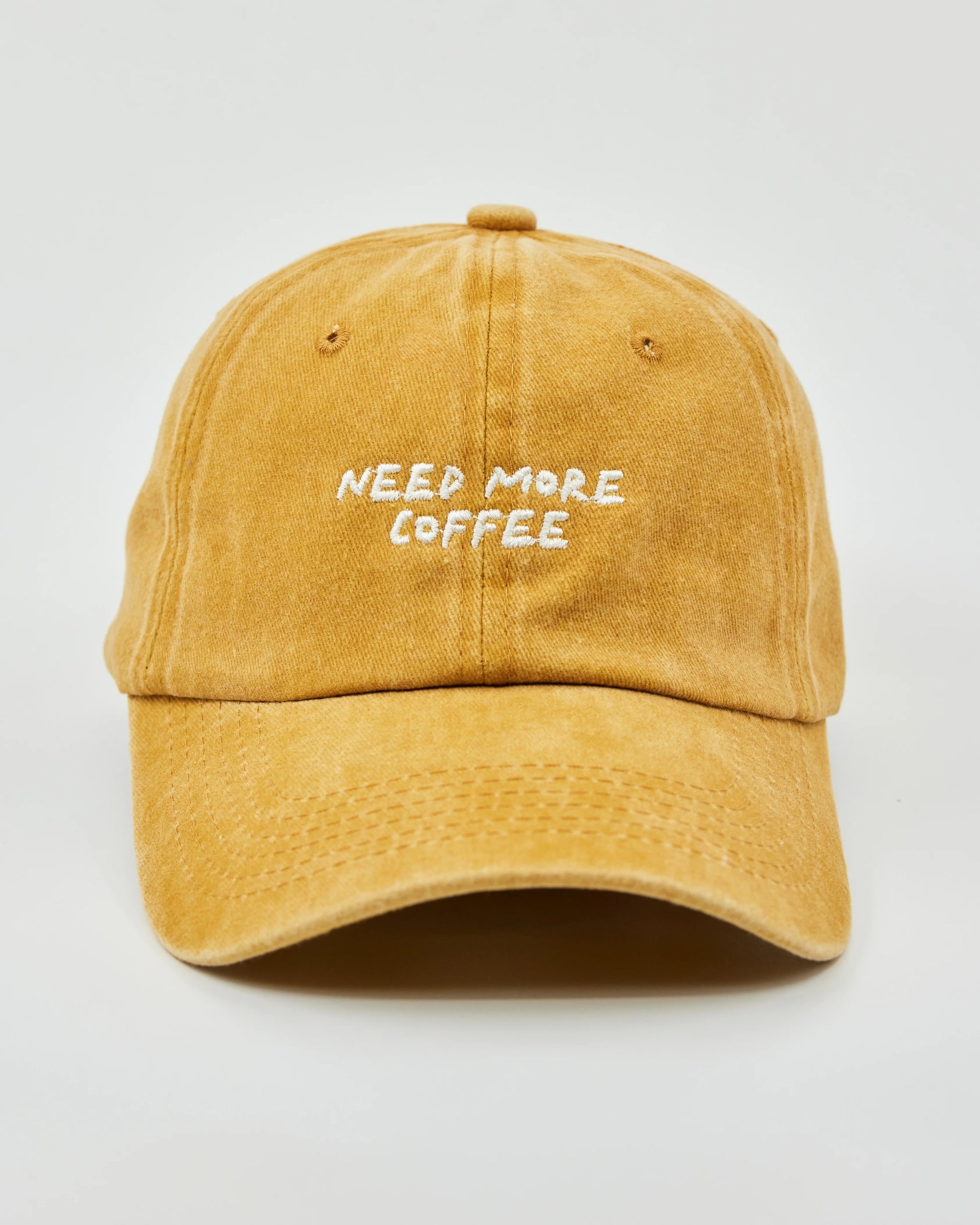 Front view of Need More Coffee Mustard Washed Cap