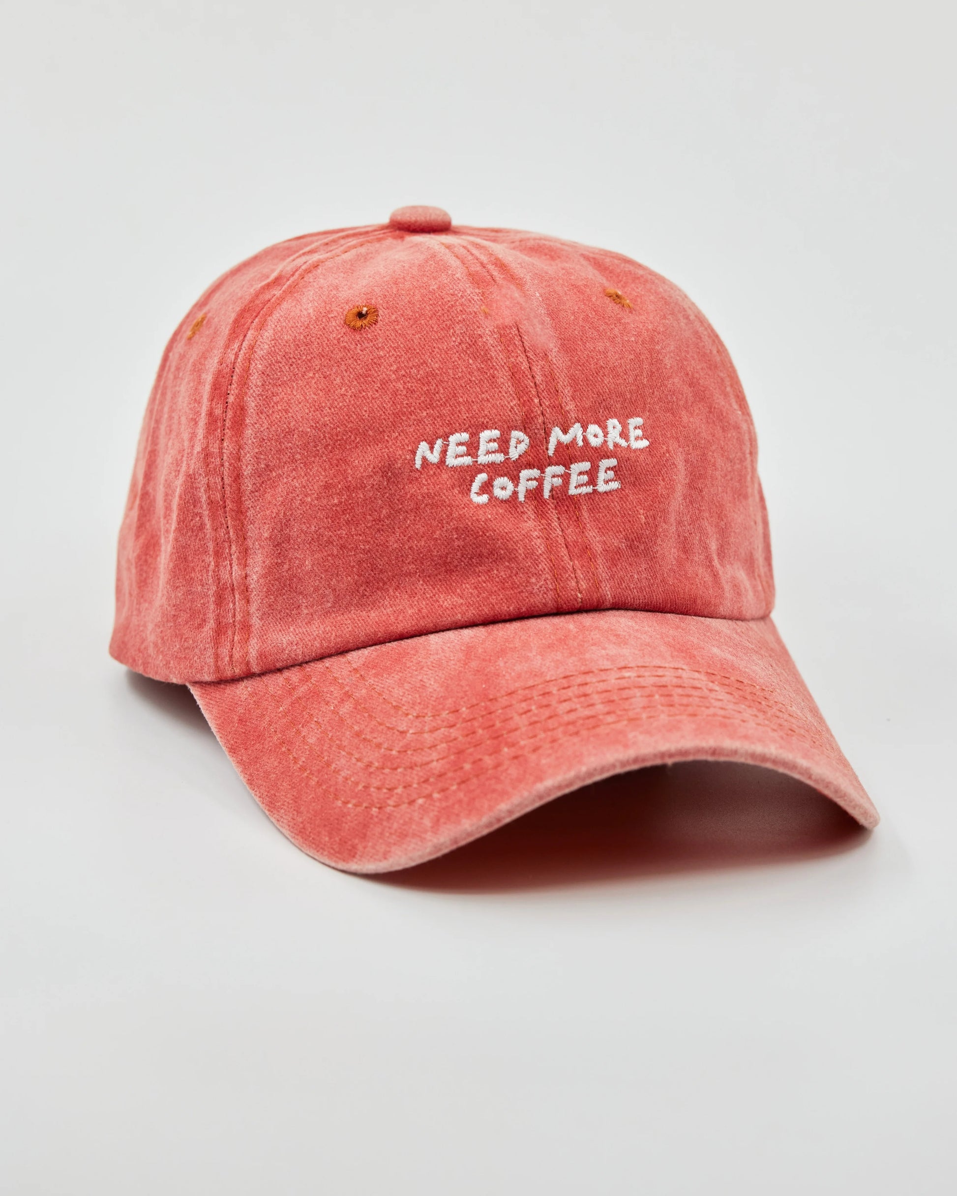 Side view of Need More Coffee Orange Washed Cap