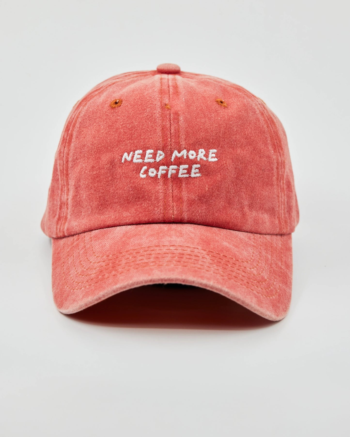 Front view of Need More Coffee Orange Washed Cap