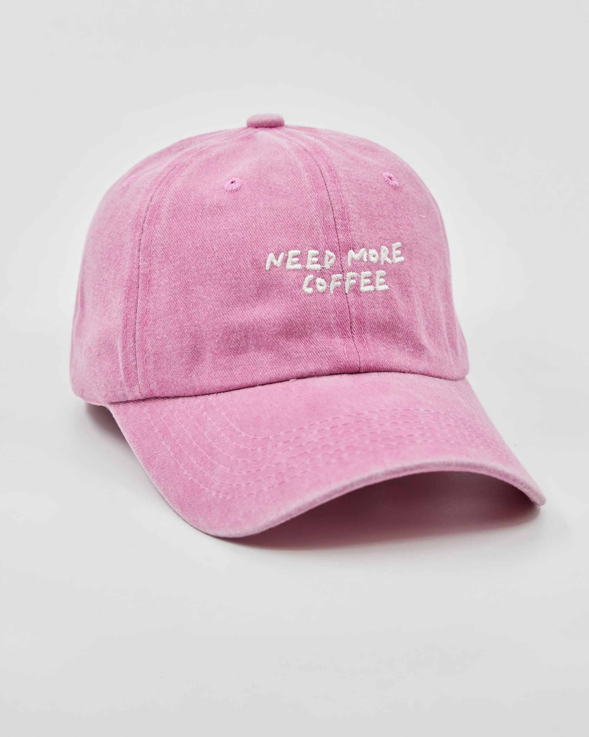 Side view of Need More Coffee Pink Washed Cap