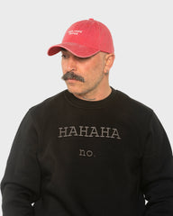 A man wearing the Need More Coffee Red Washed Cap