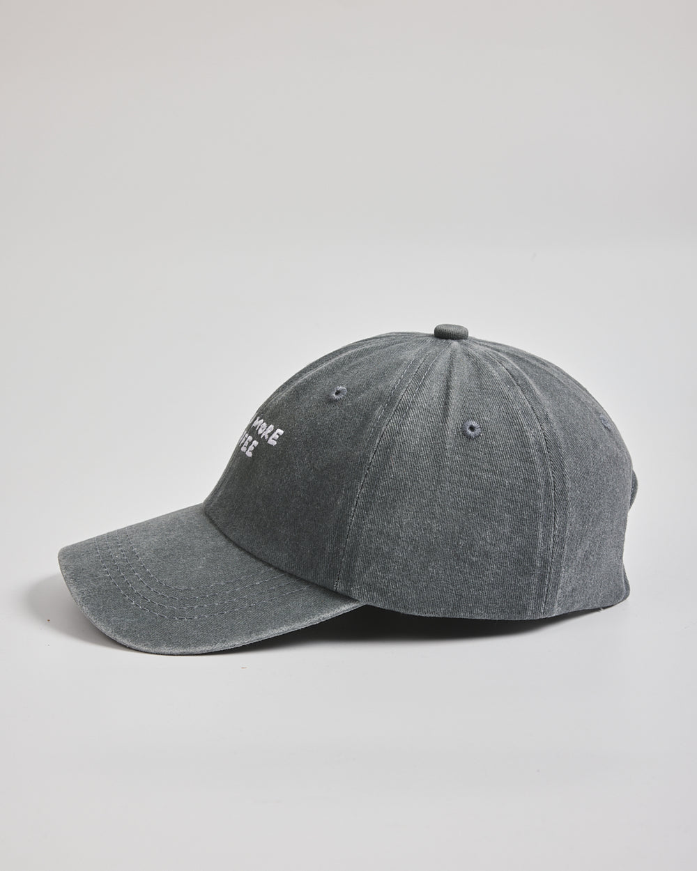 Need More Coffee Washed Grey Washed Cap on a light gray background