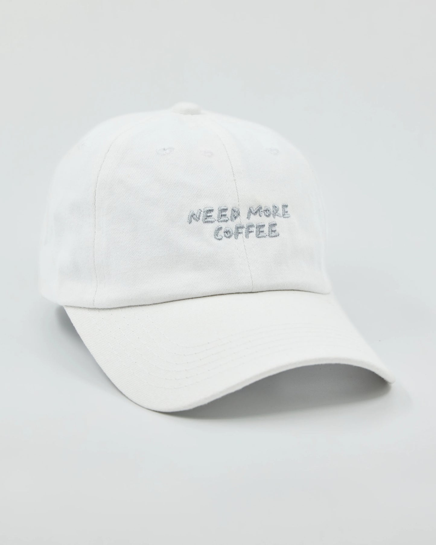 Side view of Need More Coffee White Washed Cap