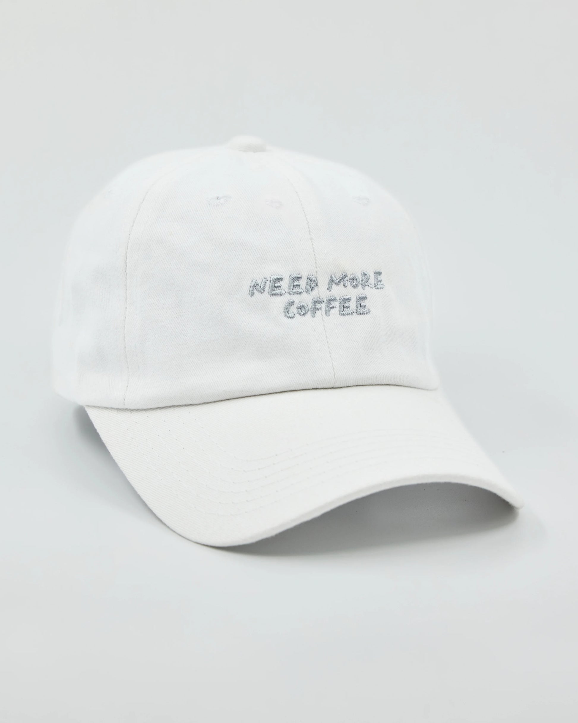 Side view of Need More Coffee White Washed Cap