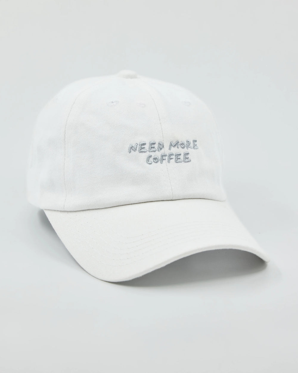 Side view of Need More Coffee White Washed Cap