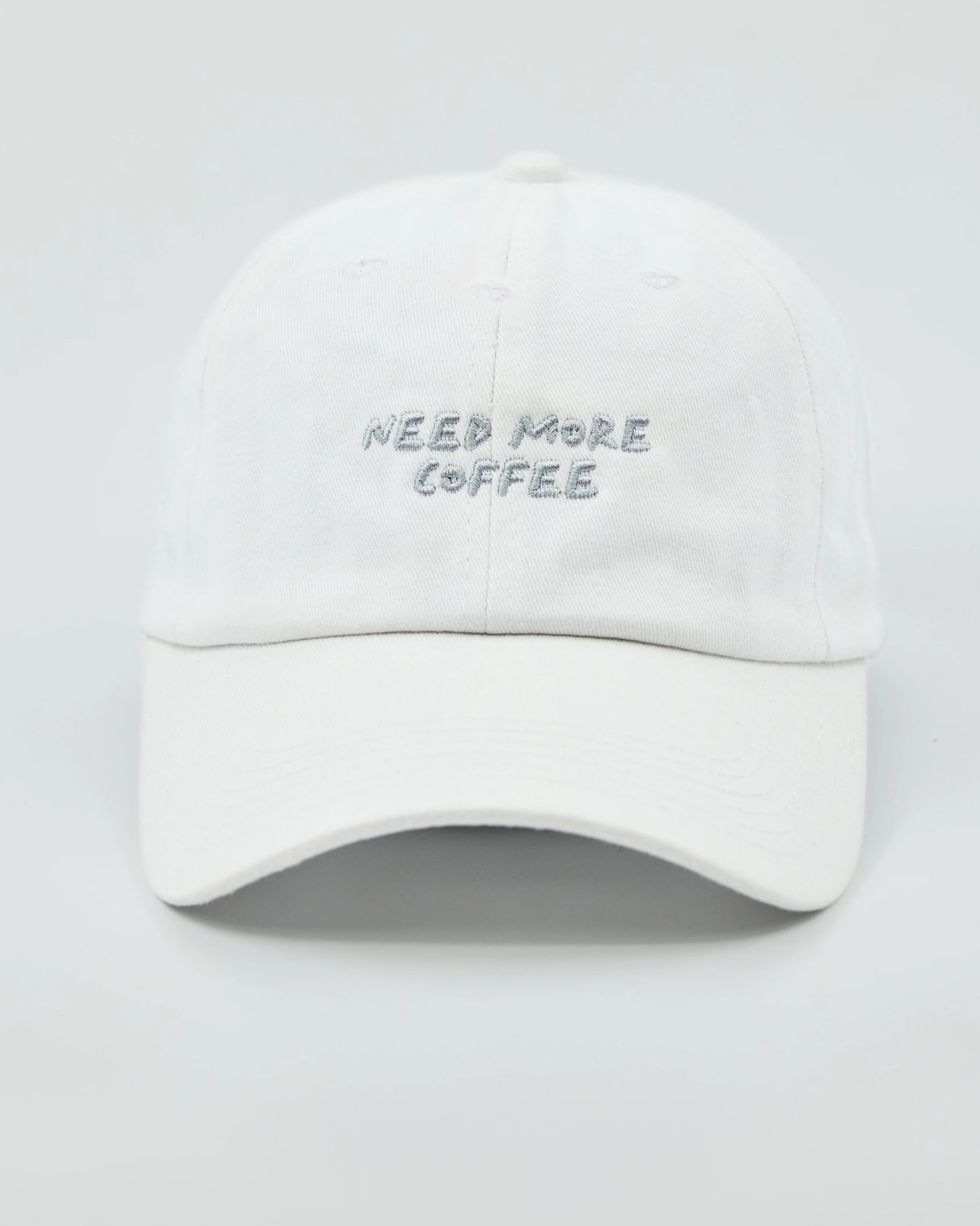 Front view of Need More Coffee White Washed Cap