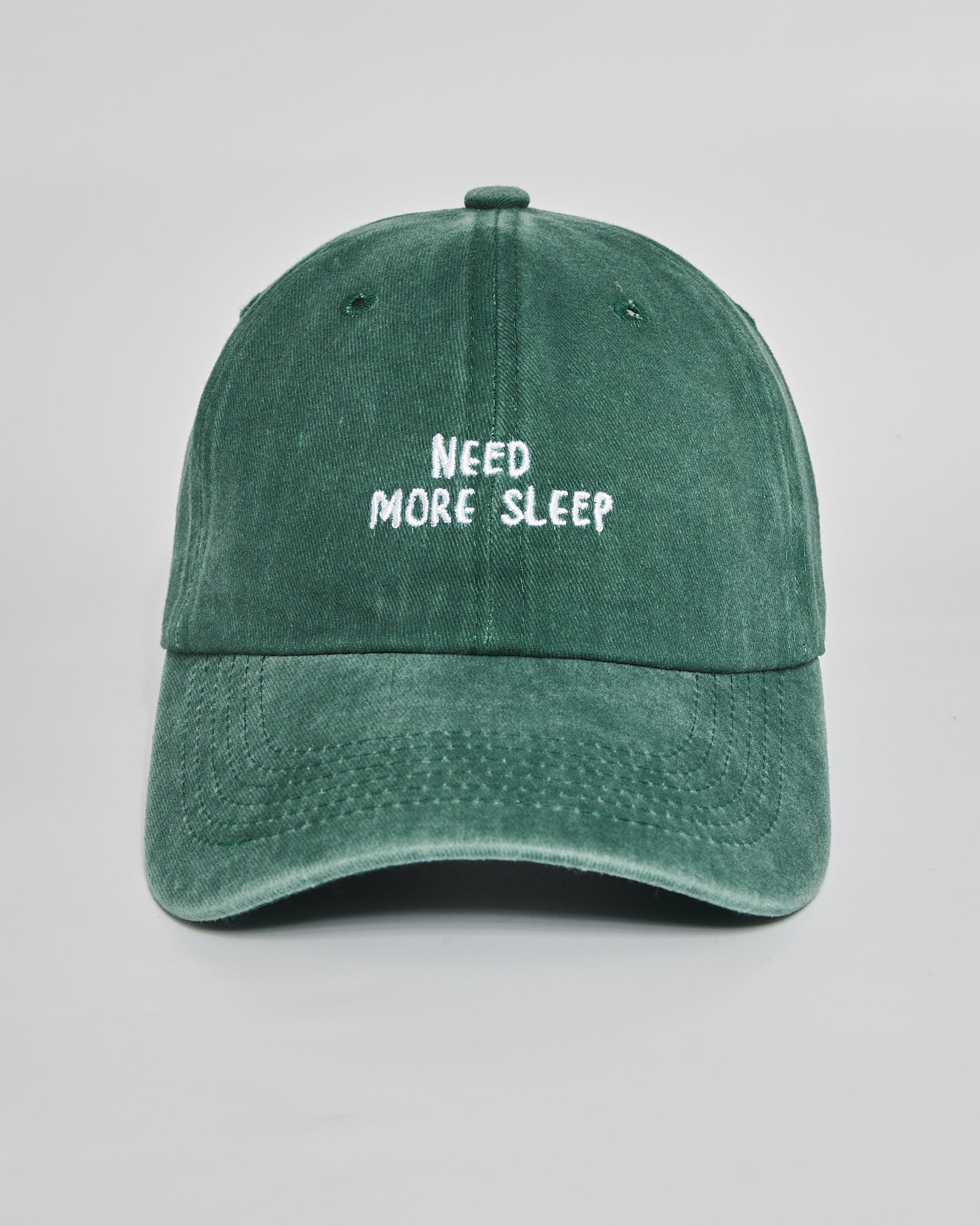 Need More Sleep forest green washed cap - front view