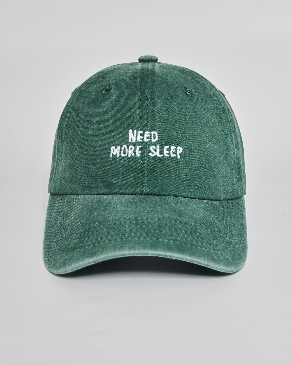 Need More Sleep forest green washed cap - front view