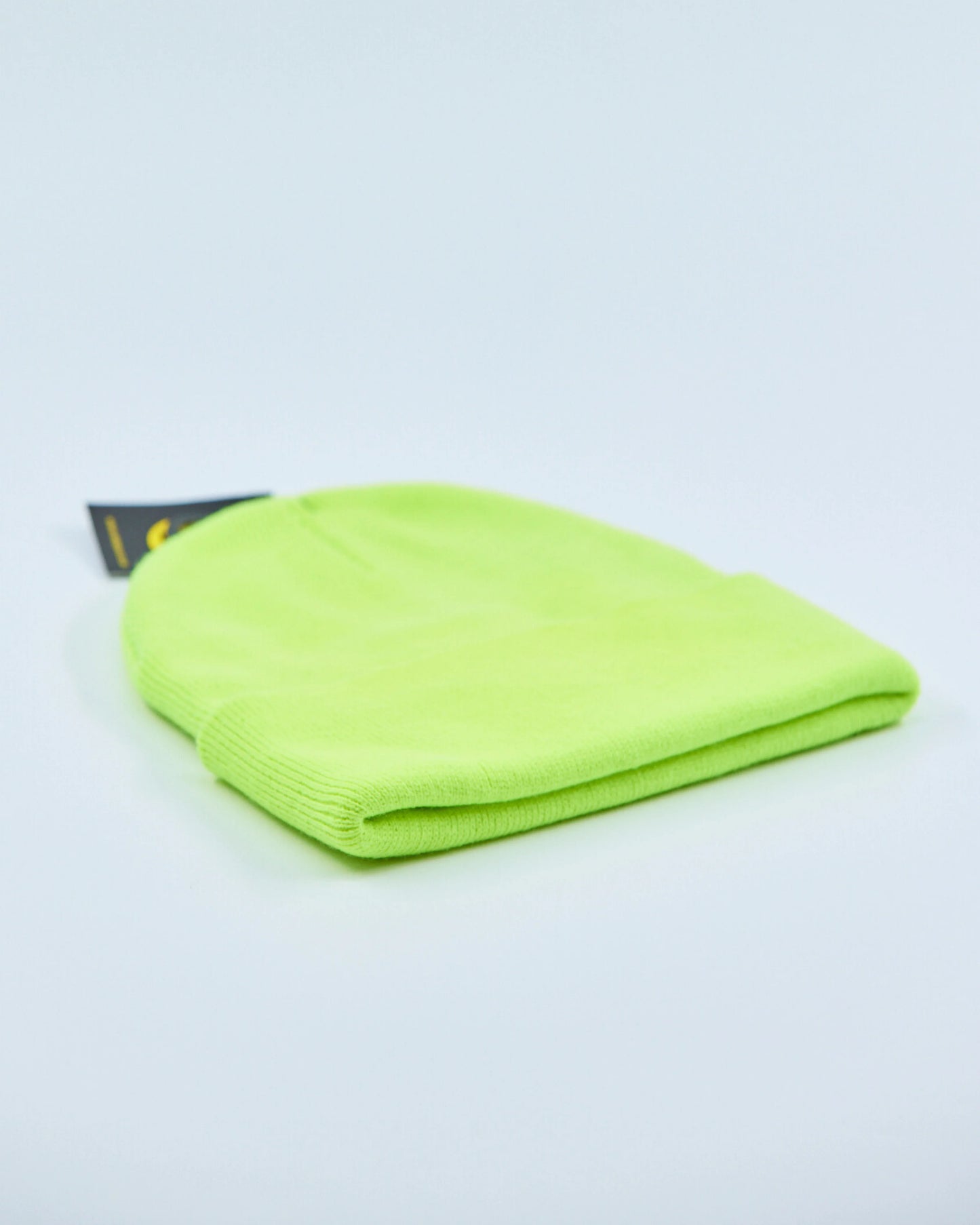 Neon green beanie on a light gray background